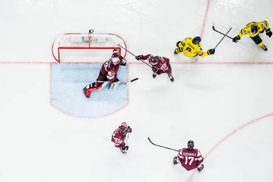 Jonas Brodin and Mika Zibanejad of Sweden celebrate