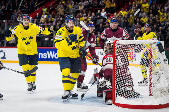 Leo Carlsson and Elias Lindholm of Sweden celebrate the 0-6