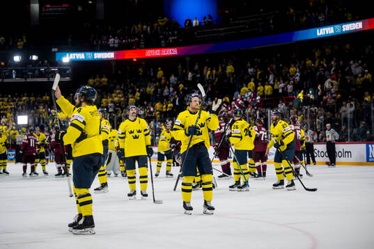 Rasmus Andersson and Jonas Brodin of Sweden celebrating