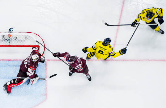 Jonas Brodin and Mika Zibanejad of Sweden celebrate