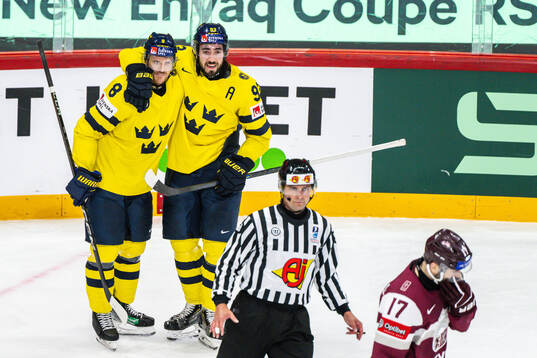 Jonas Brodin and Mika Zibanejad of Sweden celebrate the 0-5