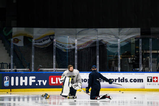 Goaltender coach Anthon Hansson and goaltender Samuel