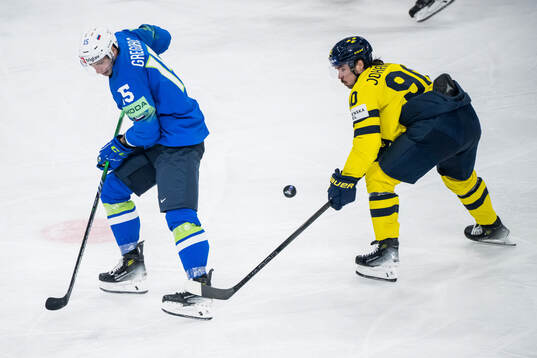 Blaz Gregorc of Slovenia and Marcus Johansson of Sweden