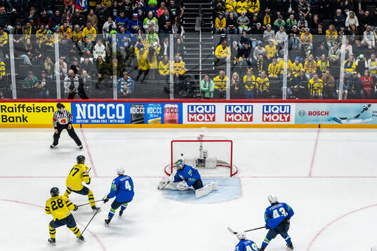 Elias Lindholm of Sweden scores the 1-0 goal behind