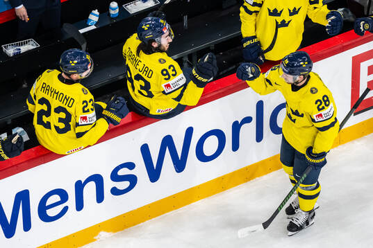 Elias Lindholm of Sweden and Mika Zibanejad celebrate