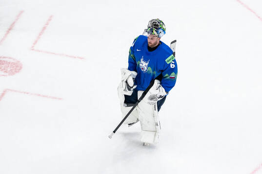goaltender Lukas Horak of Slovenia looks dejected