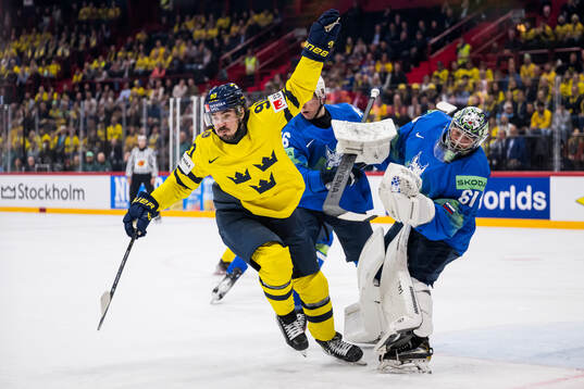 Marcus Johansson of Sweden and goaltender Lukas Horak of