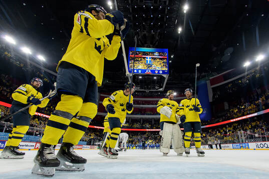 Goaltender Jacob Markström and Elias Lindholm of Sweden
