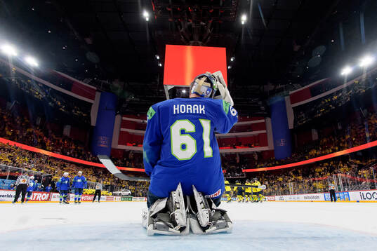Goaltender Lukas Horak of Slovenia look dejected