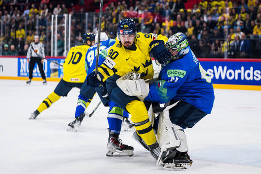 Marcus Johansson of Sweden and goaltender Lukas Horak of