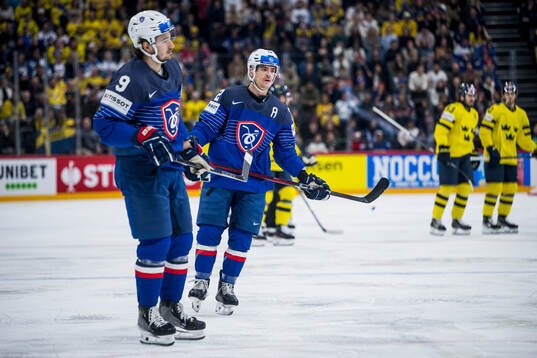 Alexandre Texier and Jordann Perret of France look dejected