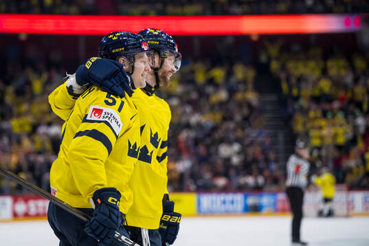 Emil Heineman and Adam Larsson of Sweden celebrate