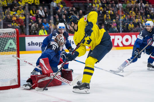 Goalkeeper Antoine Keller of France and Filip Forsberg of