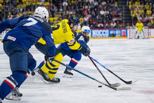 Filip Forsberg of Sweden and Pierre-Edouard Bellemare of