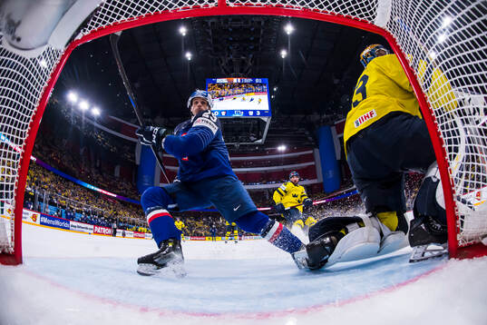 Louis Boudon of France and goaltender Samuel Ersson of