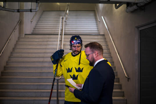 Filip Forsberg of Sweden and media officer Linus Hugosson