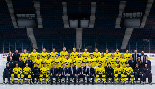Players and coaching staff of Sweden pose for a team photo