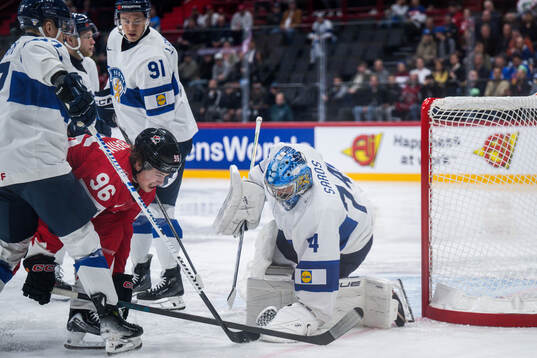 Macklin Celebrini of Canada and goaltender Juuse Saros of