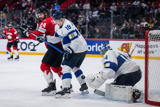 Phillip Danault of Canada against Vili Saarijärvi and