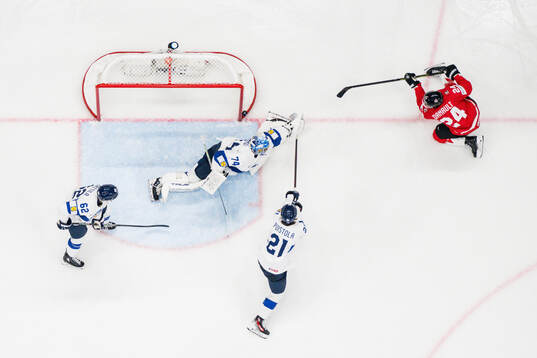 goaltender Juuse Saros and Patrik Puistola of Finland