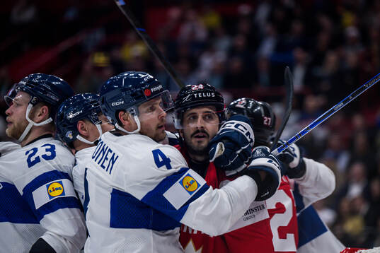 Mikko Lehtonen of Finland and Phillip Danault of Canada