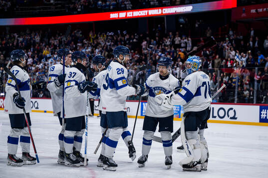 Mikko Lehtonen and Goalkeeper Juuse Saros of Finland