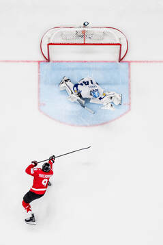 Goaltender Juuse Saros of Finland with a save against