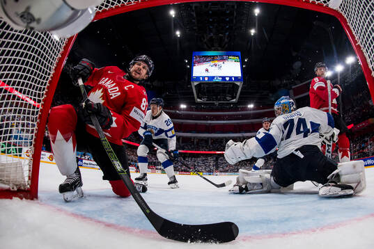 Sidney Crosby and Nathan MacKinnon of Canada against Eeli