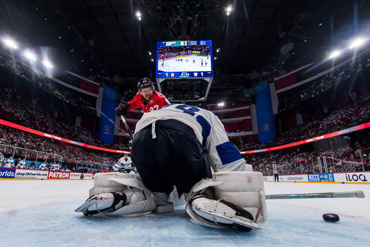 Sidney Crosby of Canada against goaltender Juuse Saros of