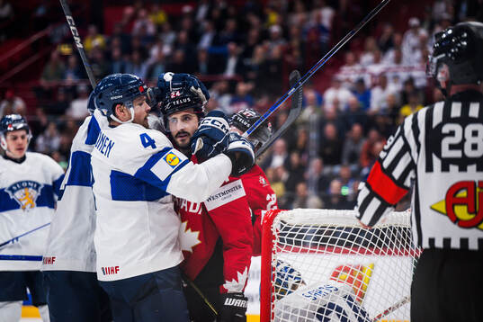 Mikko Lehtonen of Finland and Phillip Danault of Canada