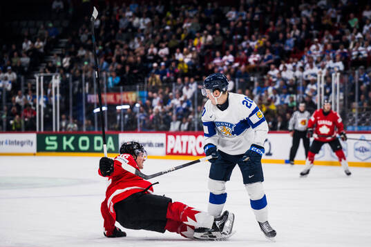 Macklin Celebrini of Canada and Eeli Tolvanen of Finland