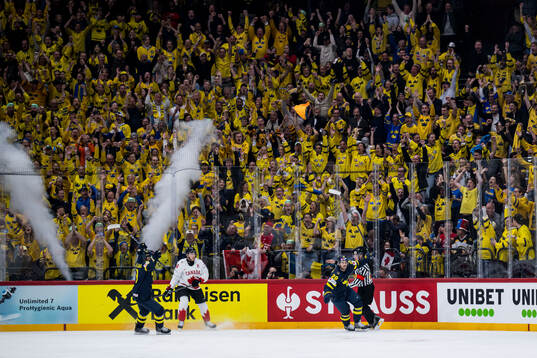 Mikael Backlund and Elias Lindholm of Sweden celebrate