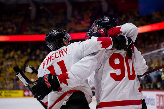 Travis Konecny and Ryan O'Reilly of Canada celebrate