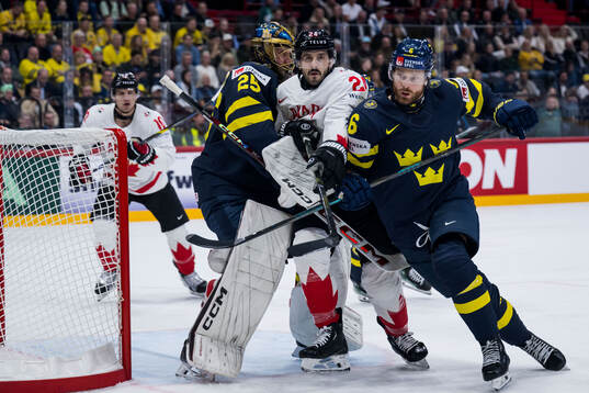 Goaltender Jacob Markström and Adam Larsson of Sweden