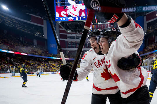 Macklin Celebrini and Tyson Foerster celebrate