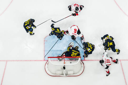 Travis Sanheim of Canada scores 0-1 behind goaltender Jacob