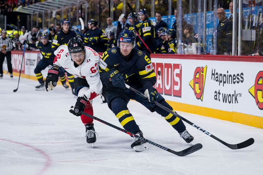 Brandon Montour of Canada and Emil Heineman of Sweden