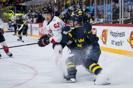 Brandon Montour of Canada and Emil Heineman of Sweden
