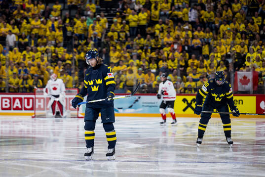 William Karlsson and Marcus Johansson of Sweden look