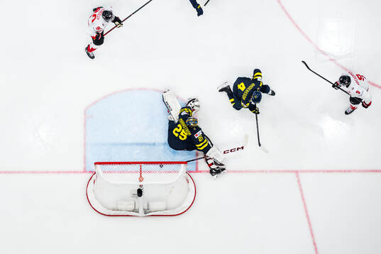 Nathan MacKinnon of Canada scores 2-5 behind goaltender