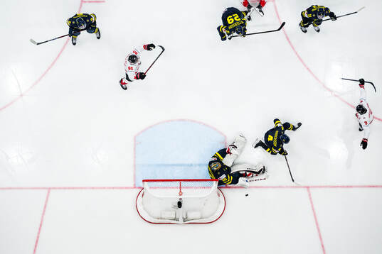 Nathan MacKinnon of Canada celebrates with Ryan O'Reilly