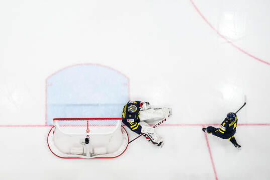 Goaltender Jacob Markström and Rasmus Andersson of Sweden