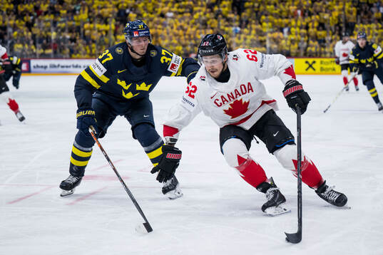 Isac Lundeström of Sweden and Brandon Montour of Canada