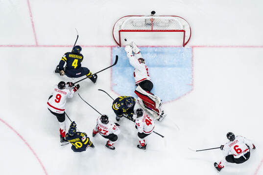 Rasmus Andersson of Sweden scores 3-5 behind goaltender
