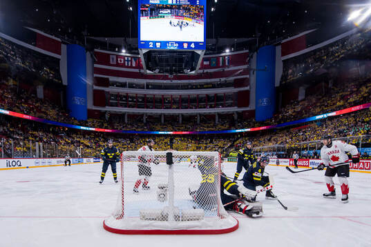 Nathan MacKinnon of Canada scores 2-5 behind goaltender