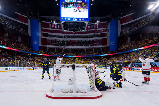 Ryan O'Reilly and Nathan MacKinnon of Canada celebrate