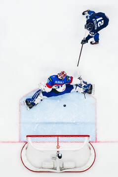 Patrik Puistola of Finland scores the 0-1 goal behind