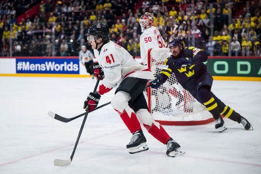 Ryker Evans of Canada and Marcus Johansson of Sweden