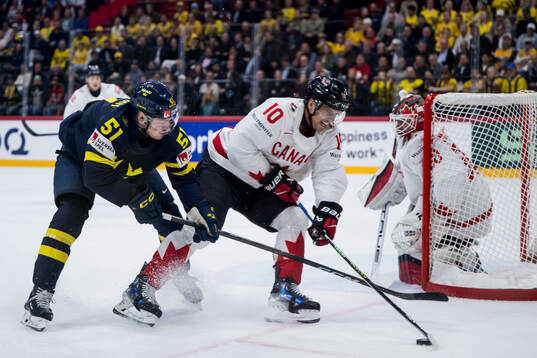 Emil Heineman of Sweden and Brayden Schenn of Canada