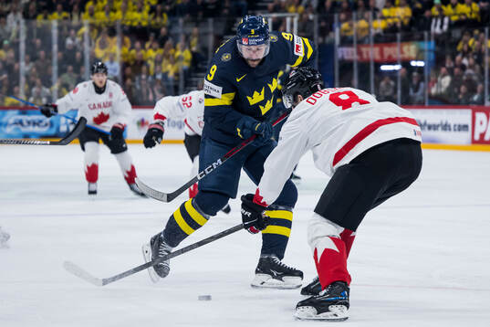 Filip Forsberg of Sweden and Noah Dobson of Canada